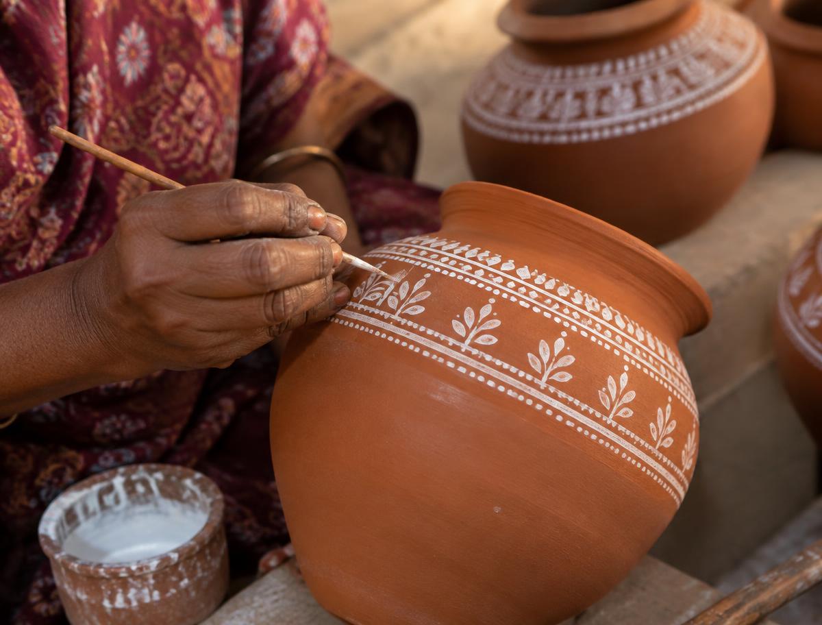Hand-painting detail on a clay piece